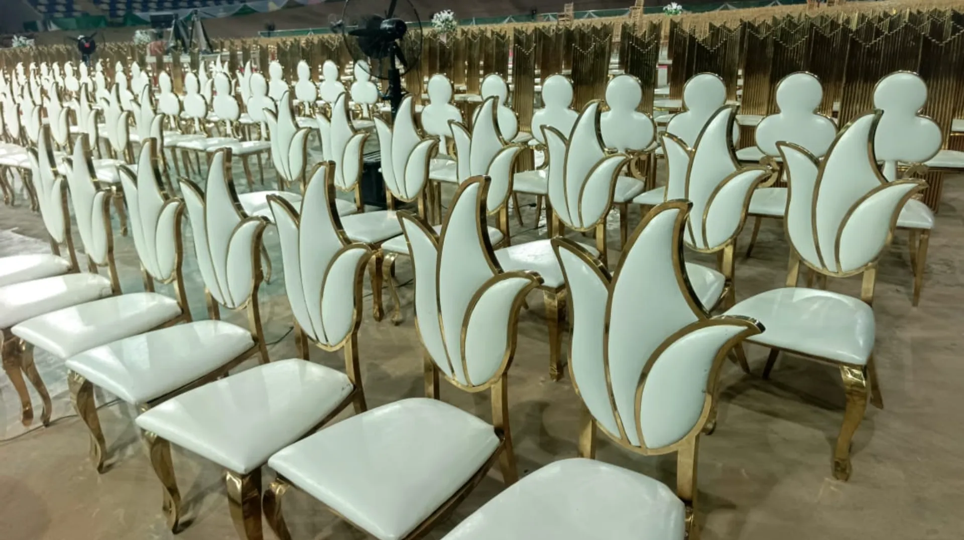 Chairs tables and canopies arranged for an event rental setup in Abuja